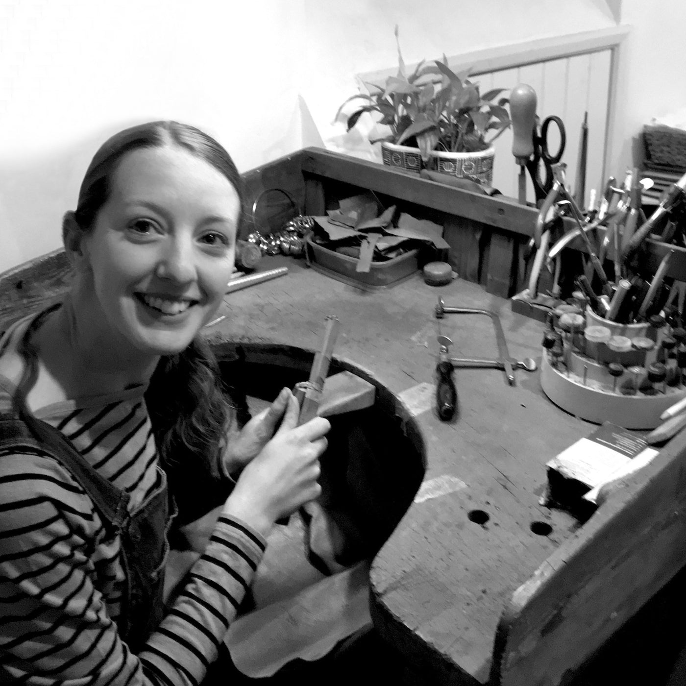 Independent jeweller Emma Mogridge making jewellery at her bench in Devon.