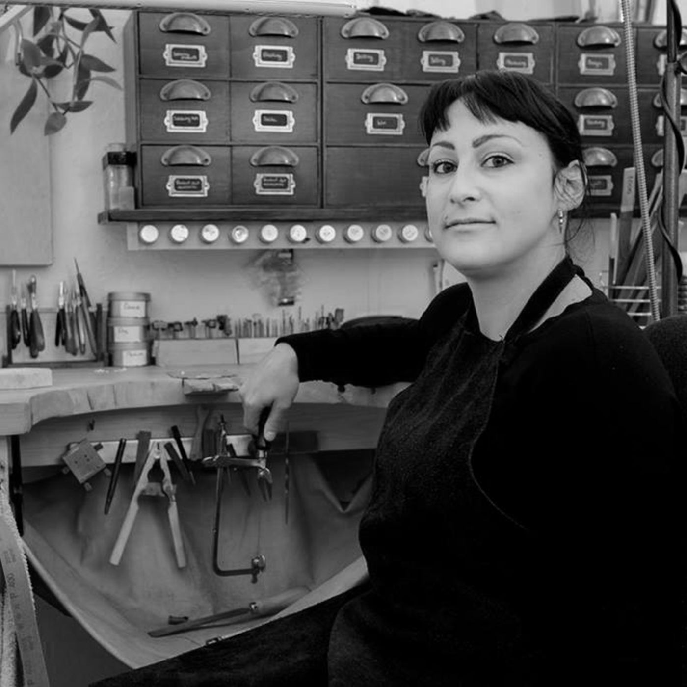 Independent jeweller Jullie Nicaisse sitting at her workbench
