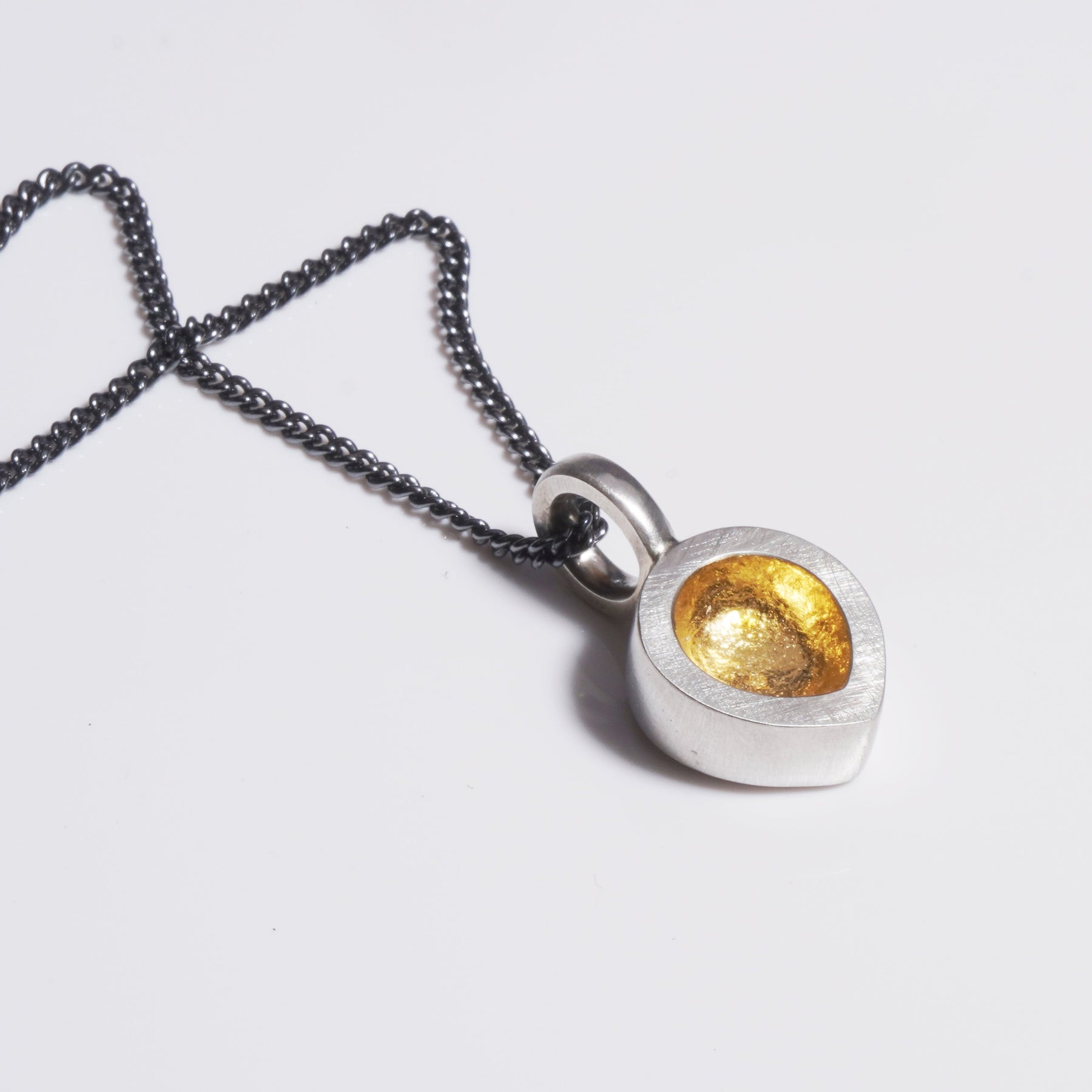 sterling silver chunky teardrop pendant with 24k gold keum boo on oxidised chain