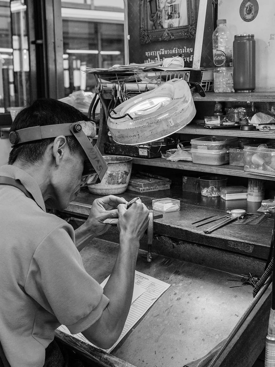 Independent jeweller in Boma crafting a ring