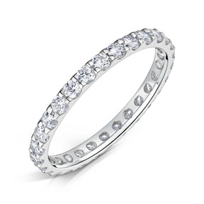 Round Brilliant cut diamonds set all around a 2.0mm white gold band in a claw style setting on a white background.