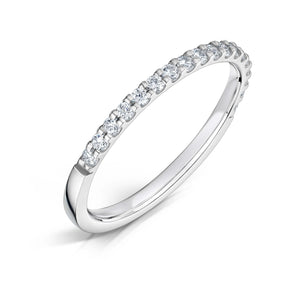 Round Brilliant cut diamonds set half way around a 1.5mm white gold band in a claw style setting on a white background.