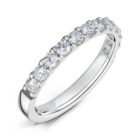 Round Brilliant cut diamonds set half way around a 2.5mm white gold band in a claw style setting on a white background.